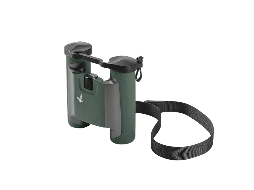 Green binoculars with a black strap on a light gray background